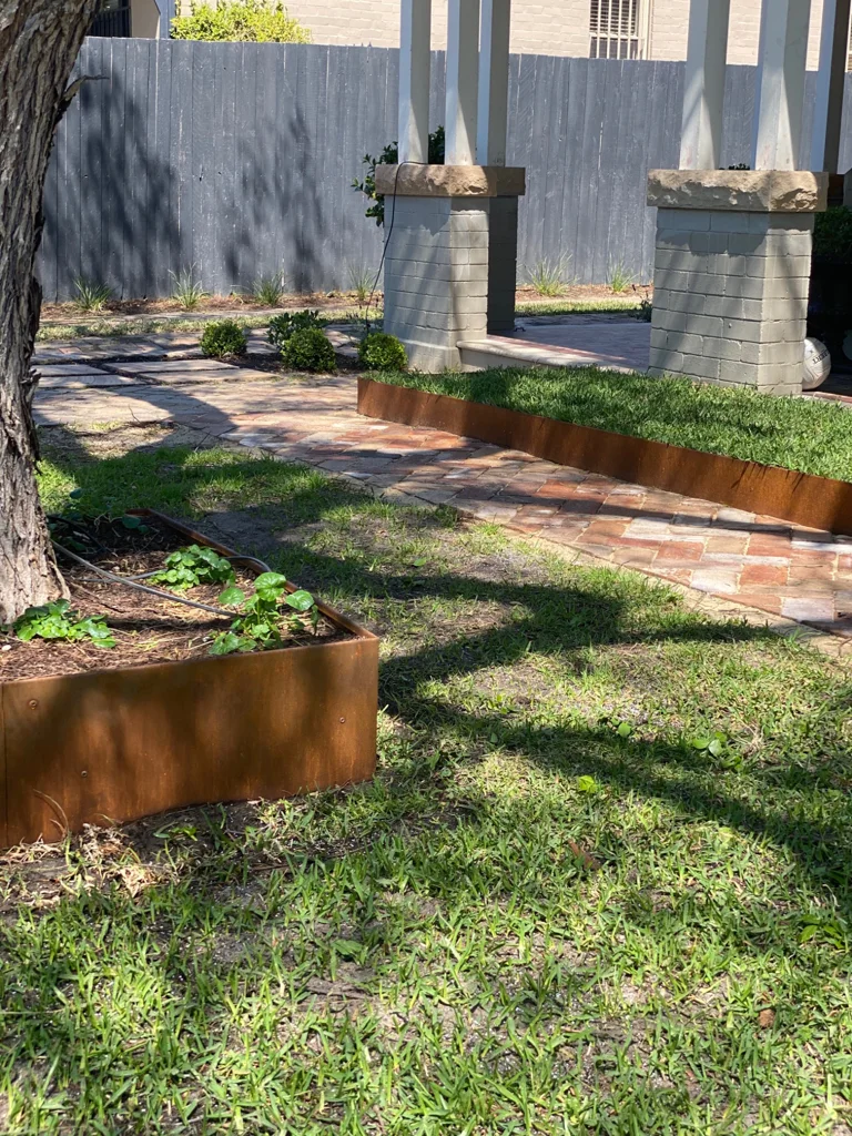 Raised lawn and garden edging around an established tree