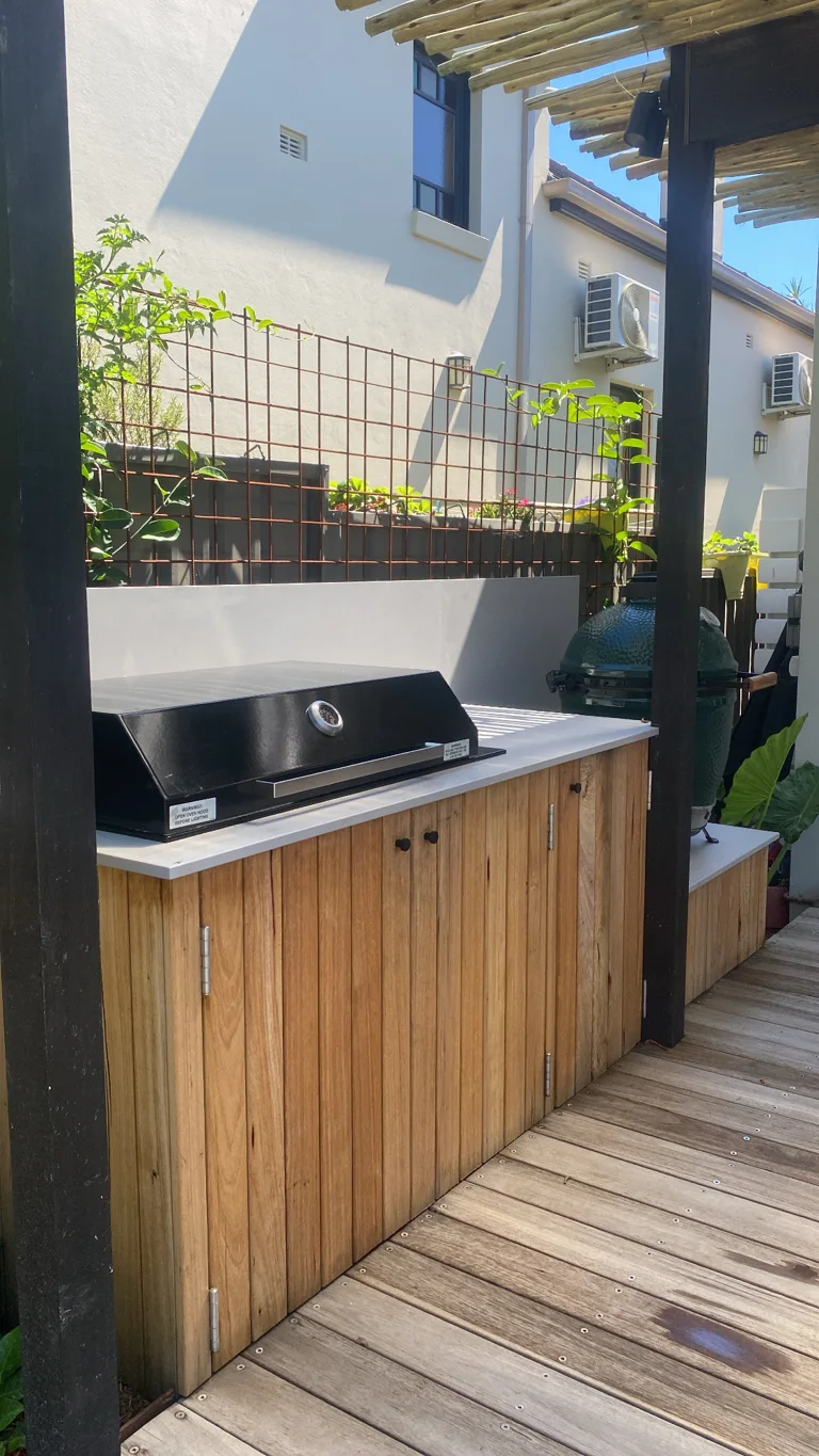 Timber-fronted outdoor kitchen on a timber deck